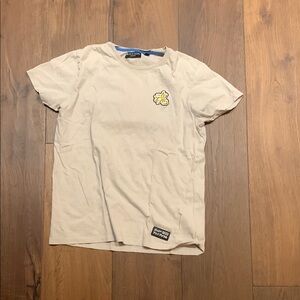 Beige T-Shirt with graphic design on the back